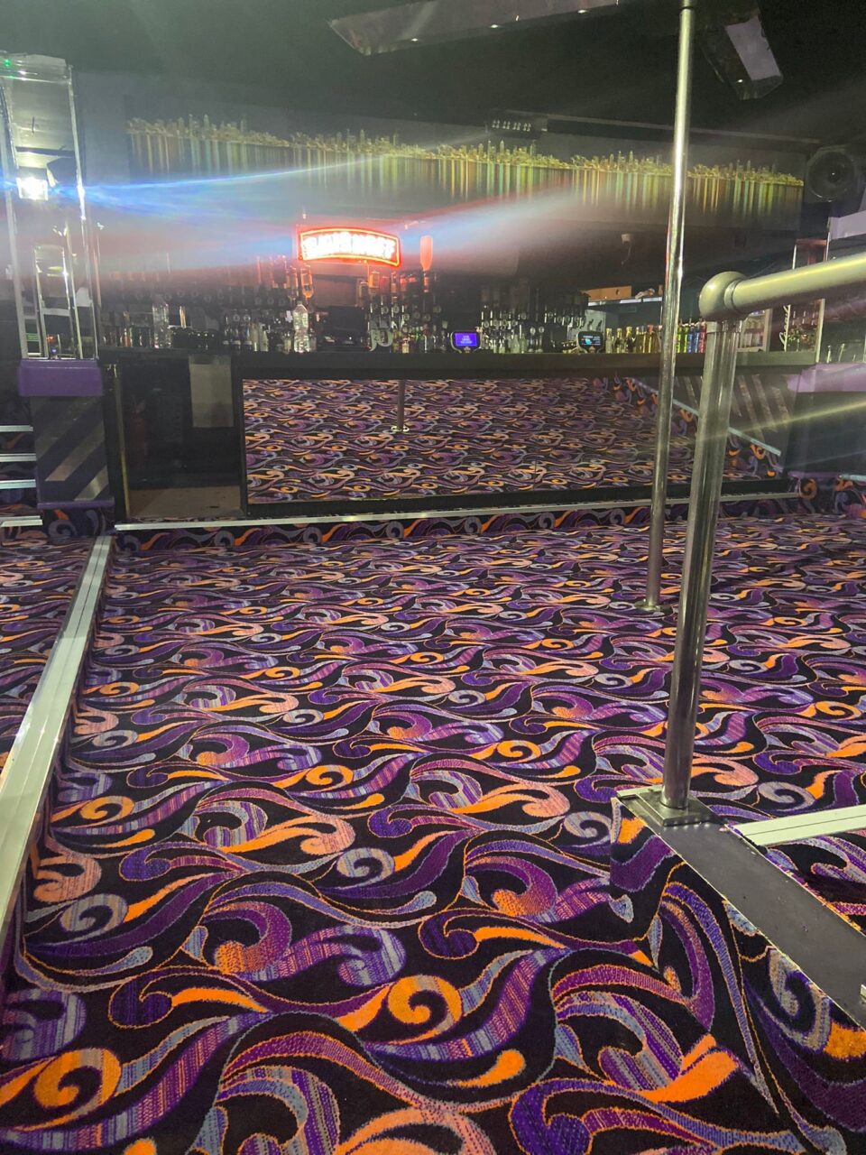 Acapulco Nightclub Halifax bar with bespoke purple and black patterned carpets designed by Wilton Carpets