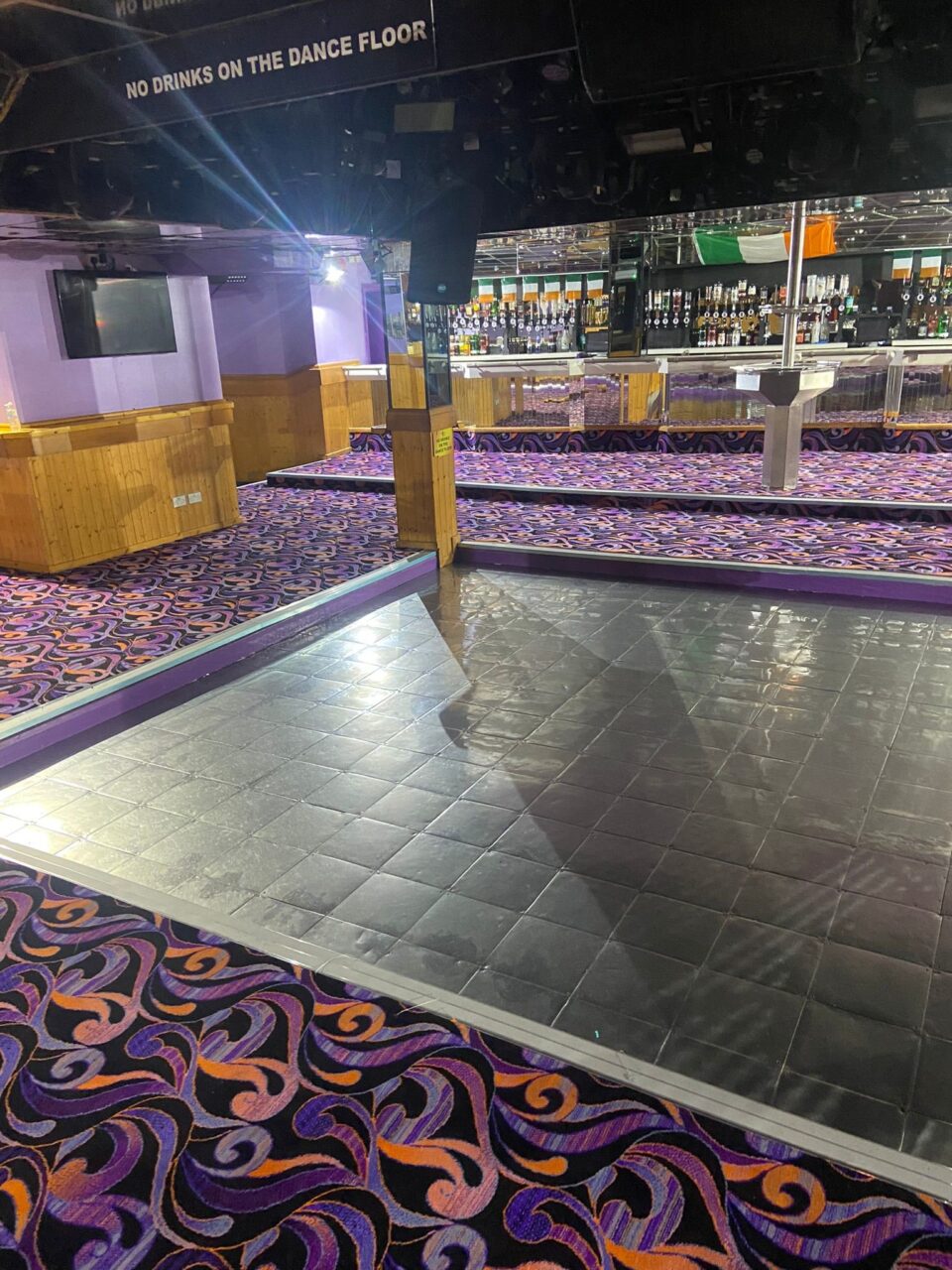 Acapulco Nightclub Halifax dance floor with bespoke purple and black patterned carpets designed by Wilton Carpets
