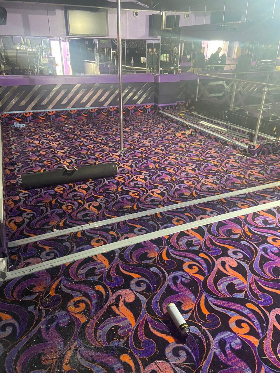 Acapulco Nightclub Halifax pole dancing area with bespoke purple and black patterned carpets designed by Wilton Carpets