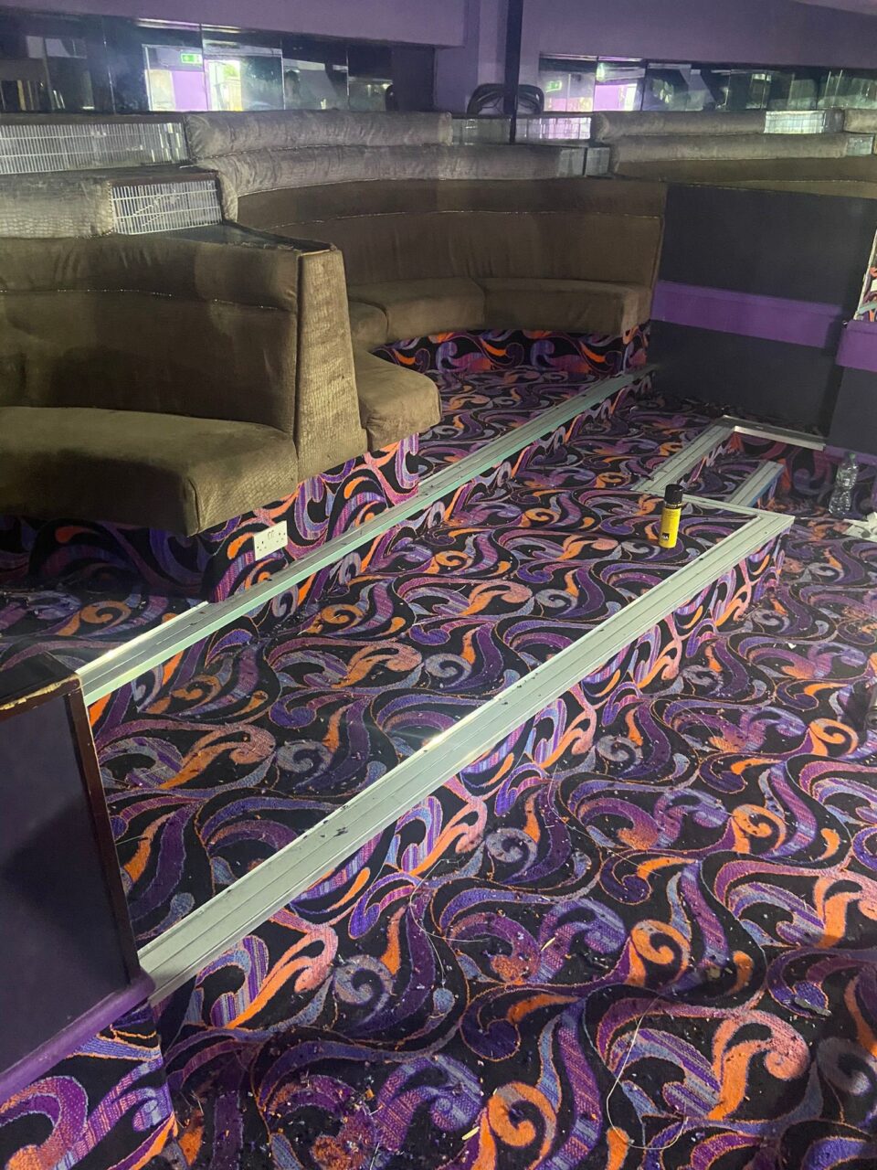 Acapulco Nightclub Halifax seating area with bespoke purple and black patterned carpets designed by Wilton Carpets