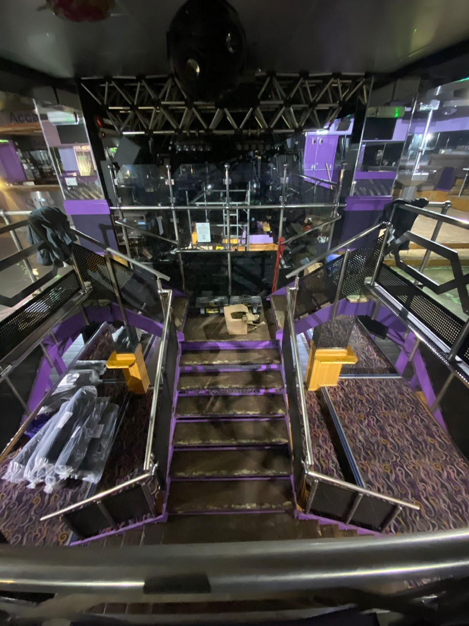 Acapulco Nightclub Halifax stairs being installed with bespoke purple and black patterned carpets designed by Wilton Carpets