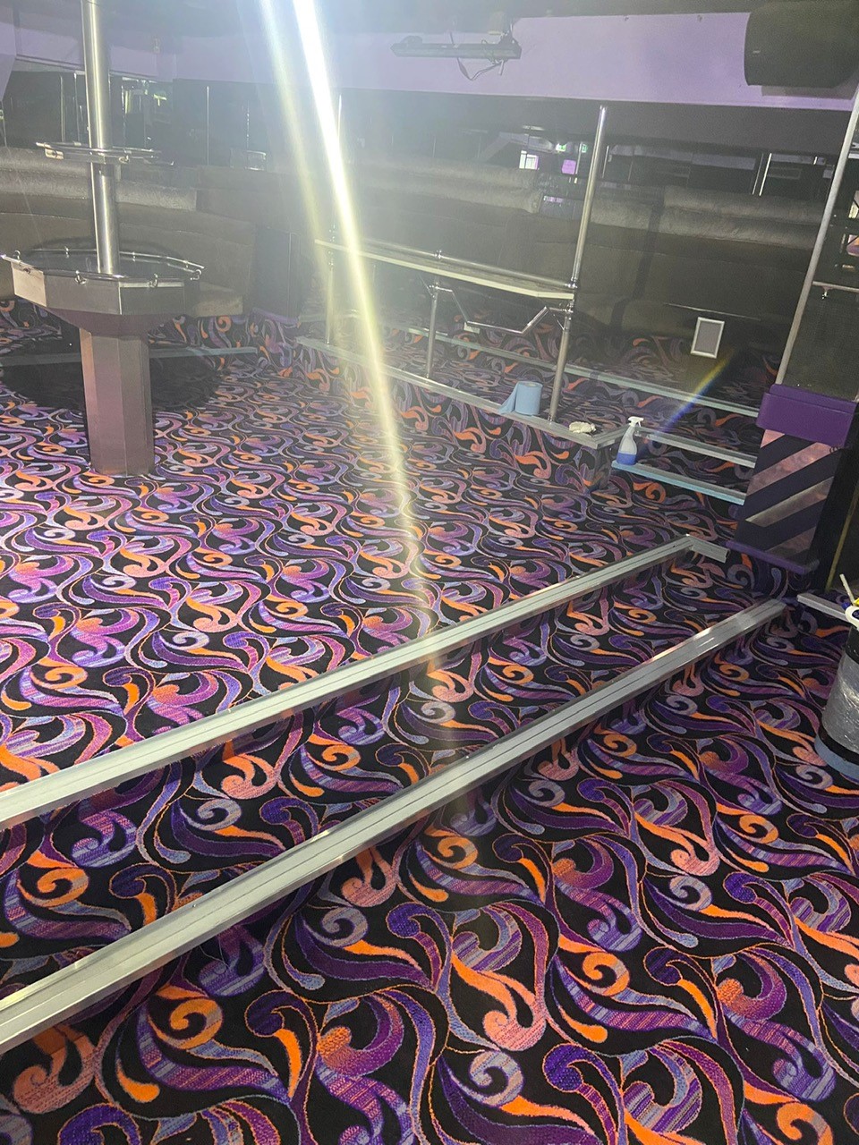 Acapulco Nightclub Halifax steps with bespoke purple and black patterned carpets designed by Wilton Carpets
