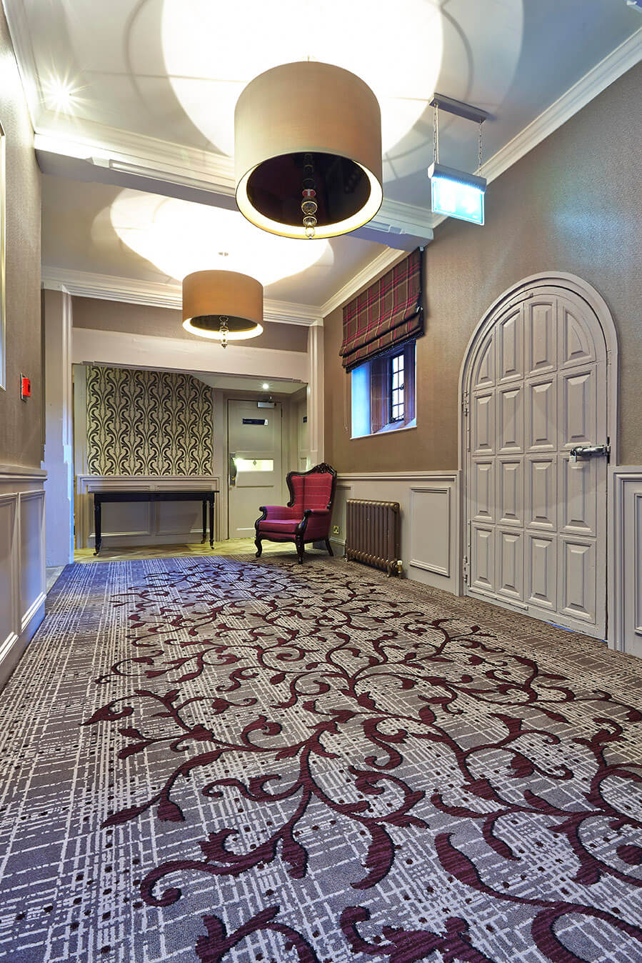 Abbey House Hotel bespoke hallway carpet, with grey and cream strips, as well as a red floral patterns, designed by Wilton Carpets