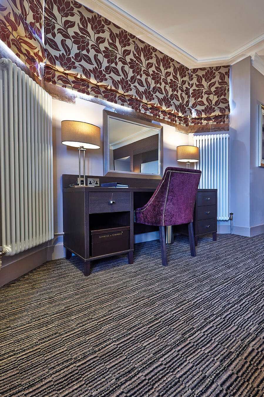 Abbey Hotel dressing room, with a black, grey and cream striped design carpet, by Wilton Carpets