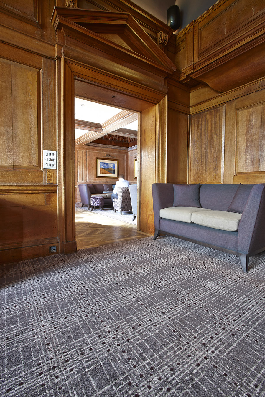Abbey House Hotel bespoke lounge area carpet, with grey and cream strips, designed by Wilton Carpets