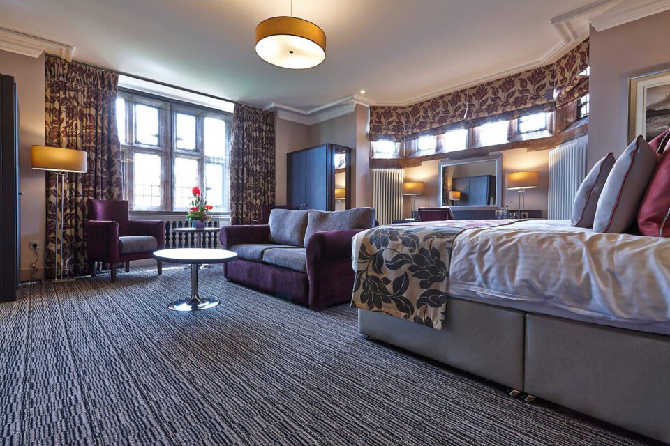 Abbey House Hotel private room, with a black, grey and cream striped design carpet, by Wilton Carpets