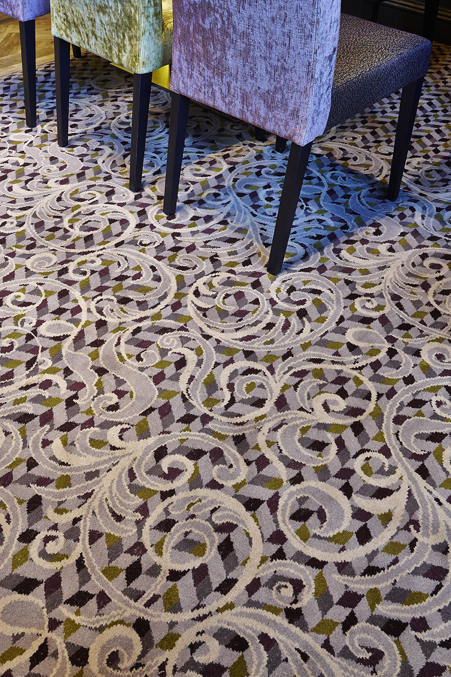 Abbey House Hotel bespoke restaurant carpet close-up, with grey and cream floral patterns, designed by Wilton Carpets